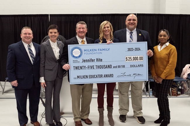 Jennifer Hite holds her $25,000 Milken Educator